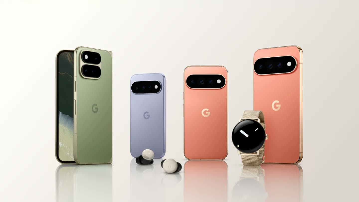 Google Pixel phones, Pixel Buds and a Pixel Watch lined up in green, lavender and coral