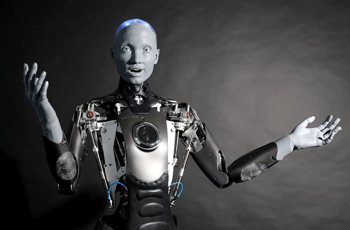 An expressive humanoid robot gesturing mid-conversation — engineered for social presence as much as physical capability